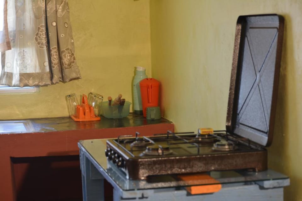 Cottage, 1 Bedroom | Private kitchen | Fridge, microwave, stovetop, coffee/tea maker