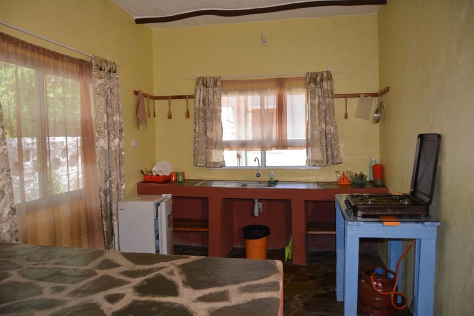Cottage, 1 Bedroom | Private kitchen | Fridge, microwave, stovetop, coffee/tea maker