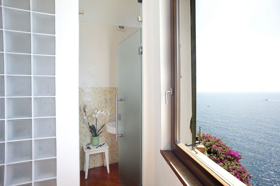 Shower, rainfall showerhead, eco-friendly toiletries, hair dryer