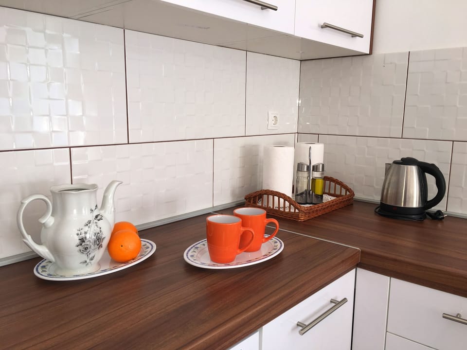 Family Apartment, Multiple Beds, Courtyard View | Private kitchen | Full-size fridge, oven, stovetop, dishwasher