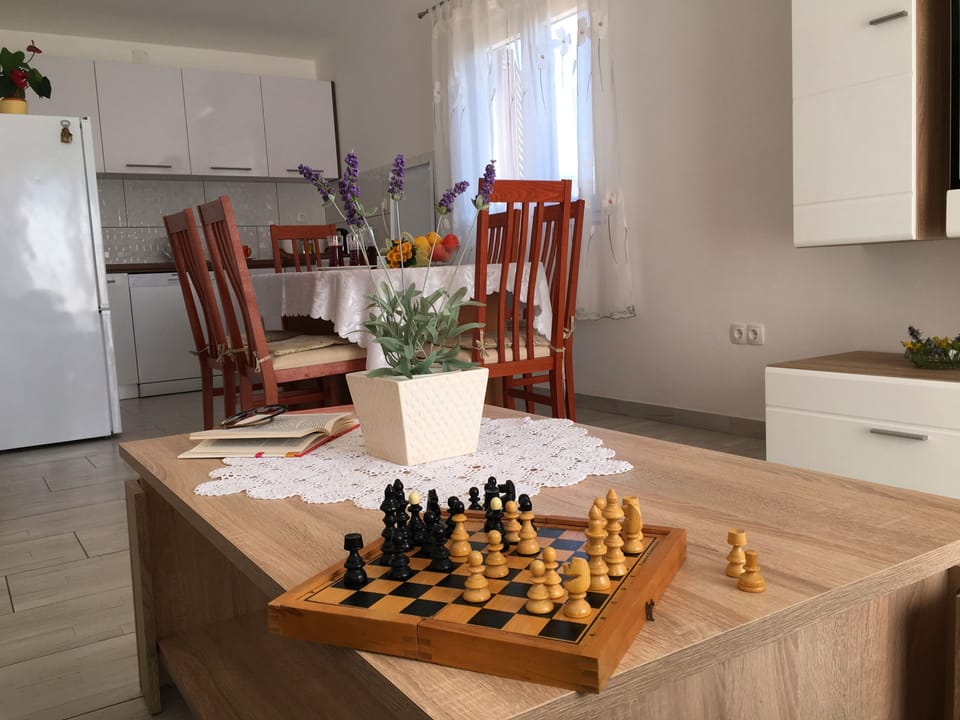 Family Apartment, Multiple Beds, Courtyard View | Living area | Flat-screen TV