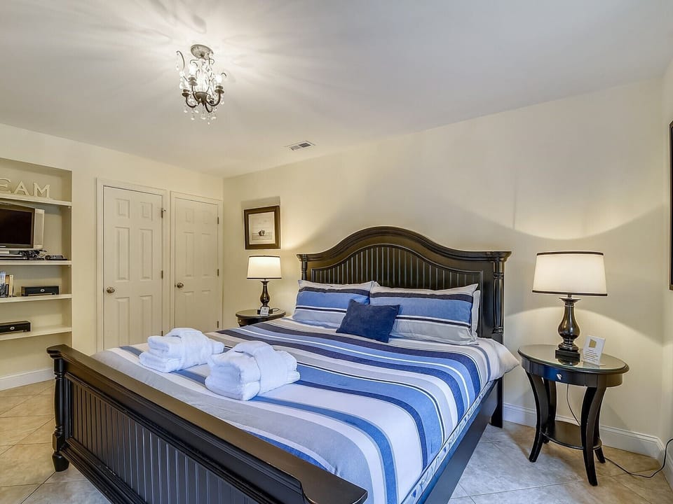 Guest Room with TV and Balcony Access at 1715 Bluff Villa