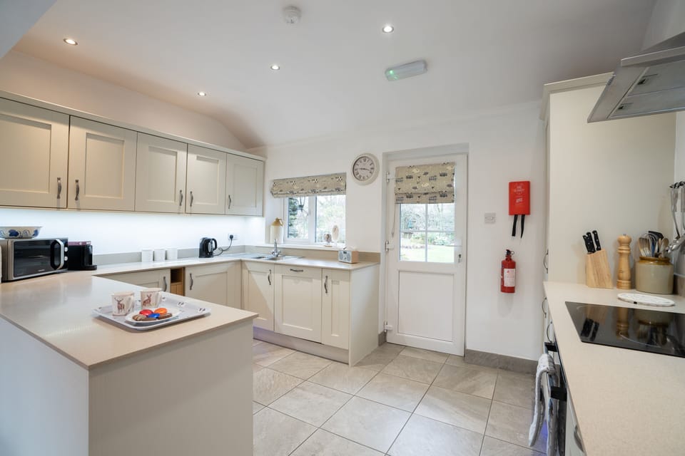 Newly fitted kitchen in riverside cottage