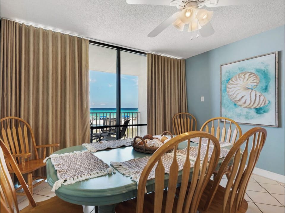 Gather around your bright dining table with stunning ocean views just beyond your private balcony doors.