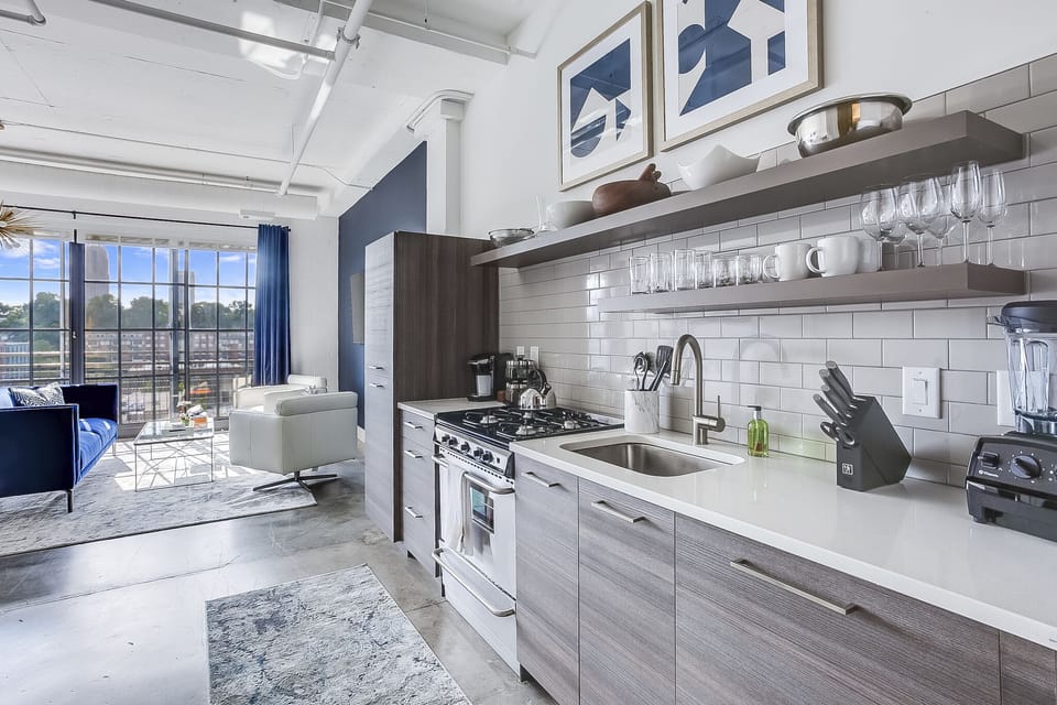 This kitchen at this Ponce Rental features and oven, sink and fridge