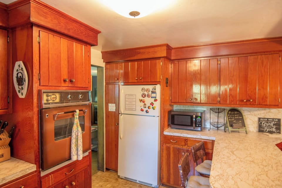 Stove, microwave and bar seating...