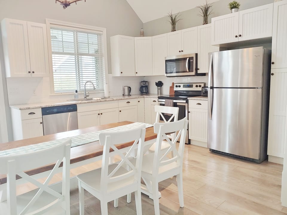 Fully stocked kitchen with seating for eight