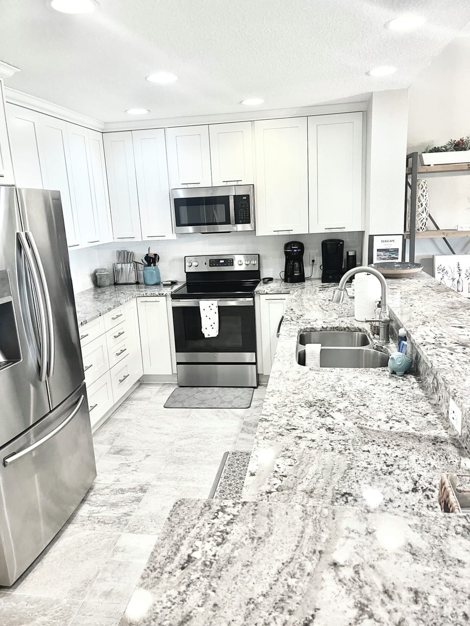 Kitchen remodel with white cabinets and granite countertops