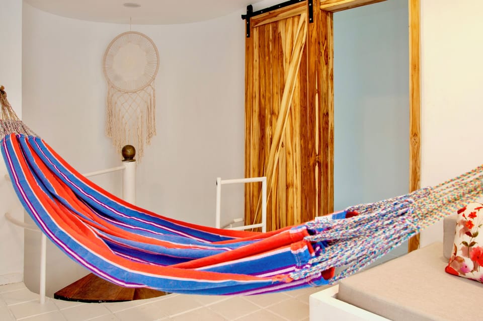 Hall across 2nd floor bedrooms with hammock