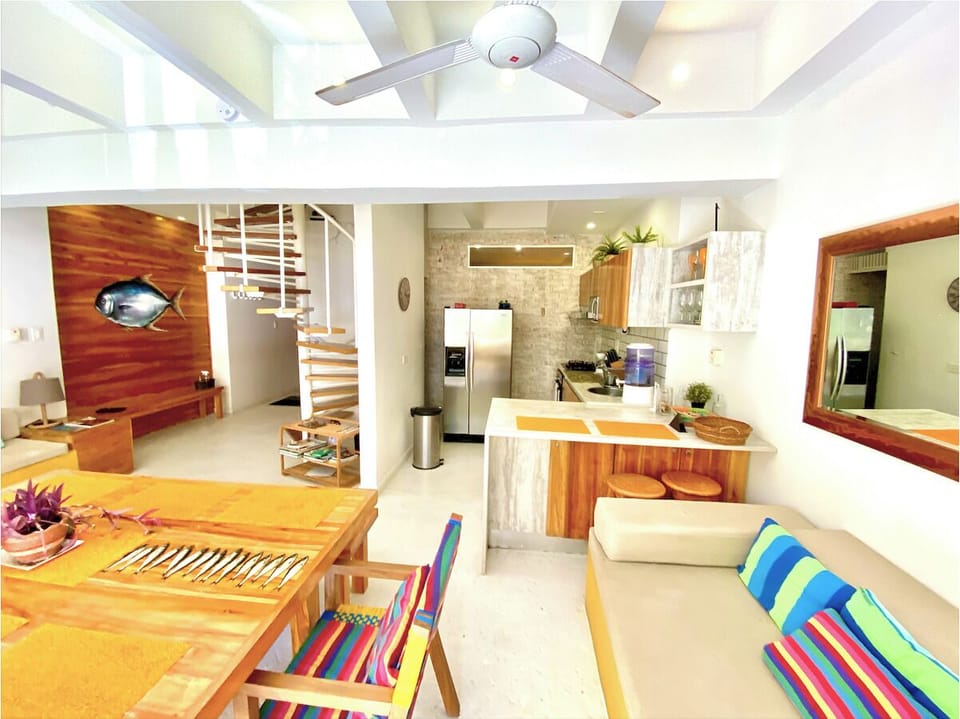 Dining table, living room and kitchen