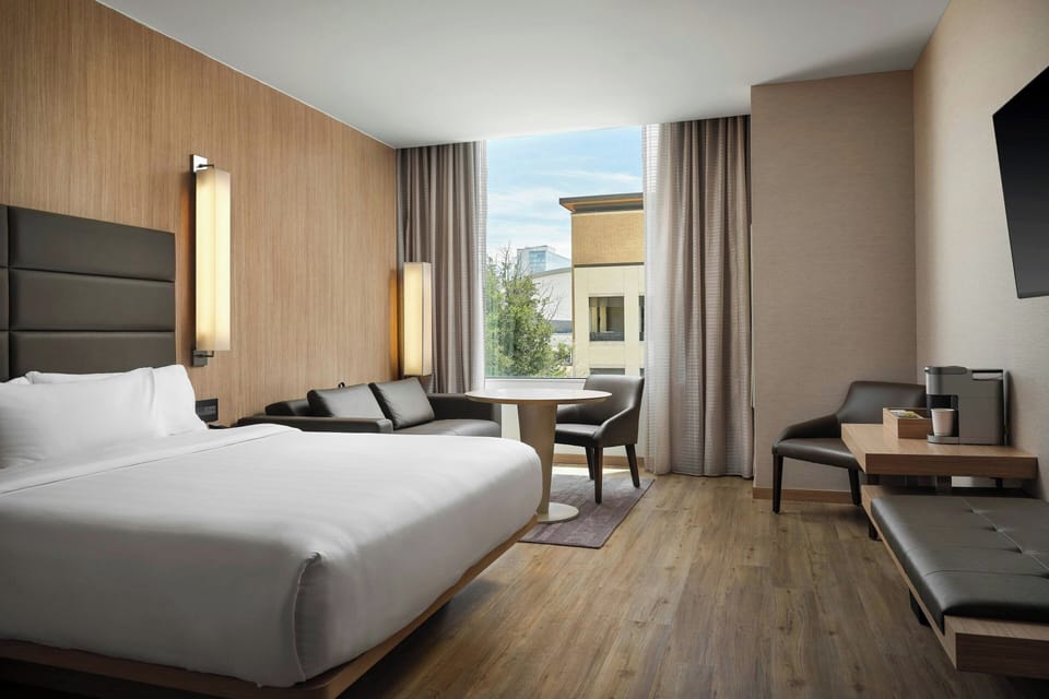 Room, 1 King Bed, Corner | 2 bedrooms, hypo-allergenic bedding, down comforters, in-room safe