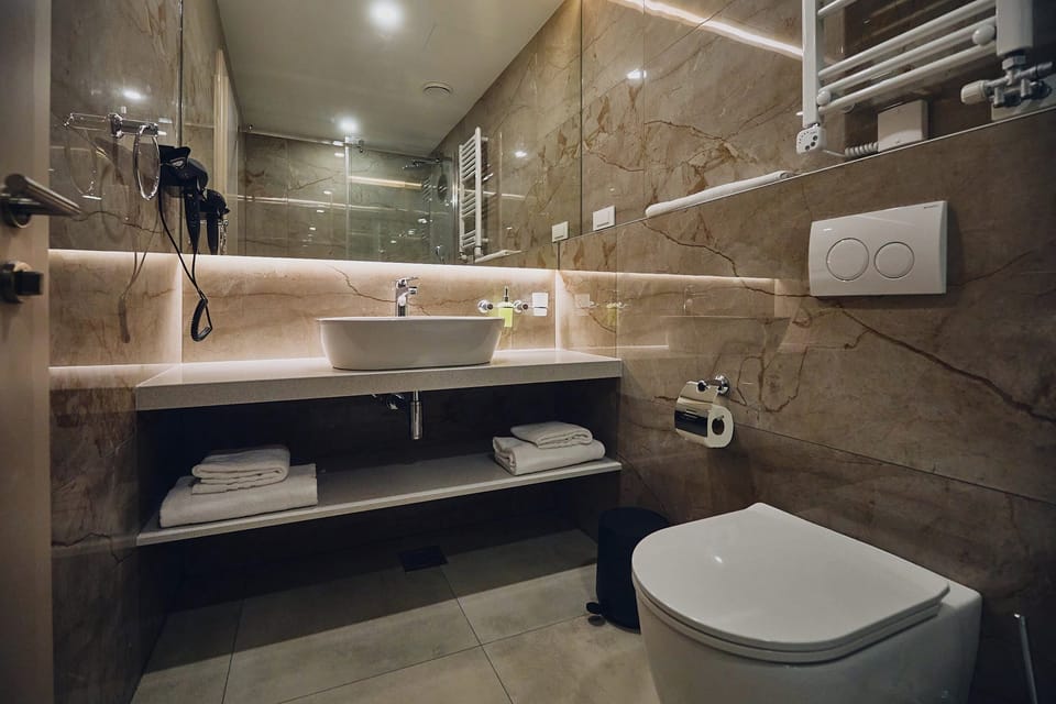 Superior Double Room | Minibar, in-room safe, desk, blackout drapes