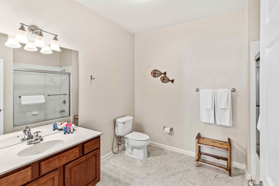 Bathroom 2 with a bathtub and a shower combo