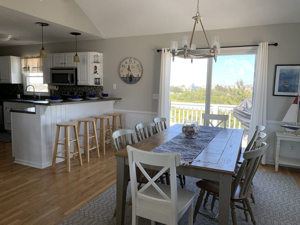 Seating for up to 12 (8 at dining table and 4 at kitchen counter). 