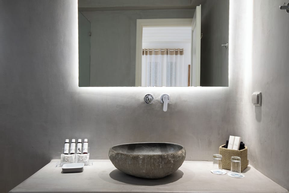 Junior Suite, Sea View | Bathroom | Shower, rainfall showerhead, designer toiletries, hair dryer