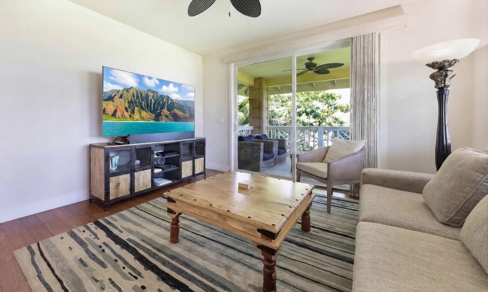 Living room area with a large smart TV