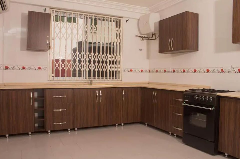 Apartment, 4 Bedrooms | Private kitchen | Fridge, microwave, oven, stovetop