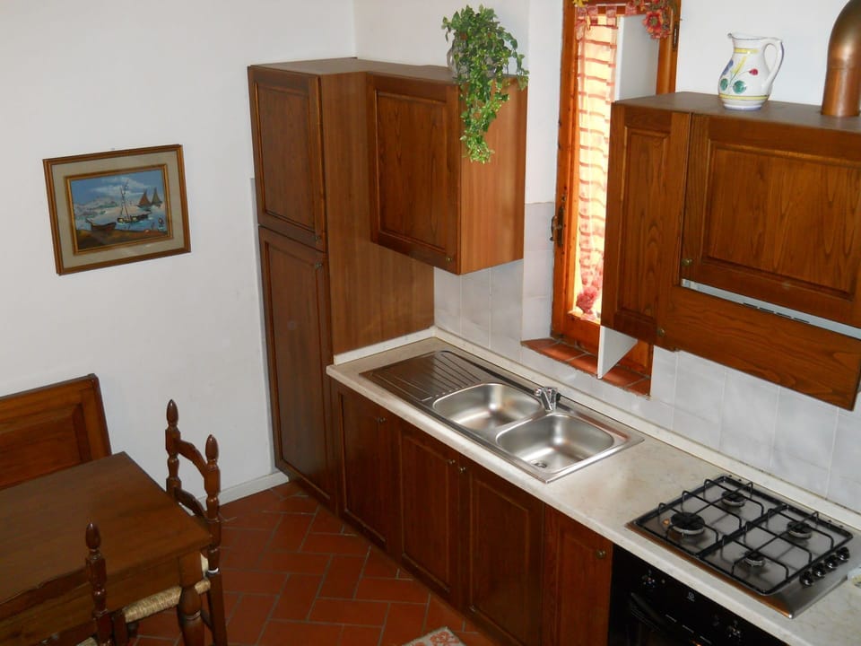Room, Furniture, Property, Cabinetry, Countertop, Wood Stain, Kitchen, House, Building, Hardwood