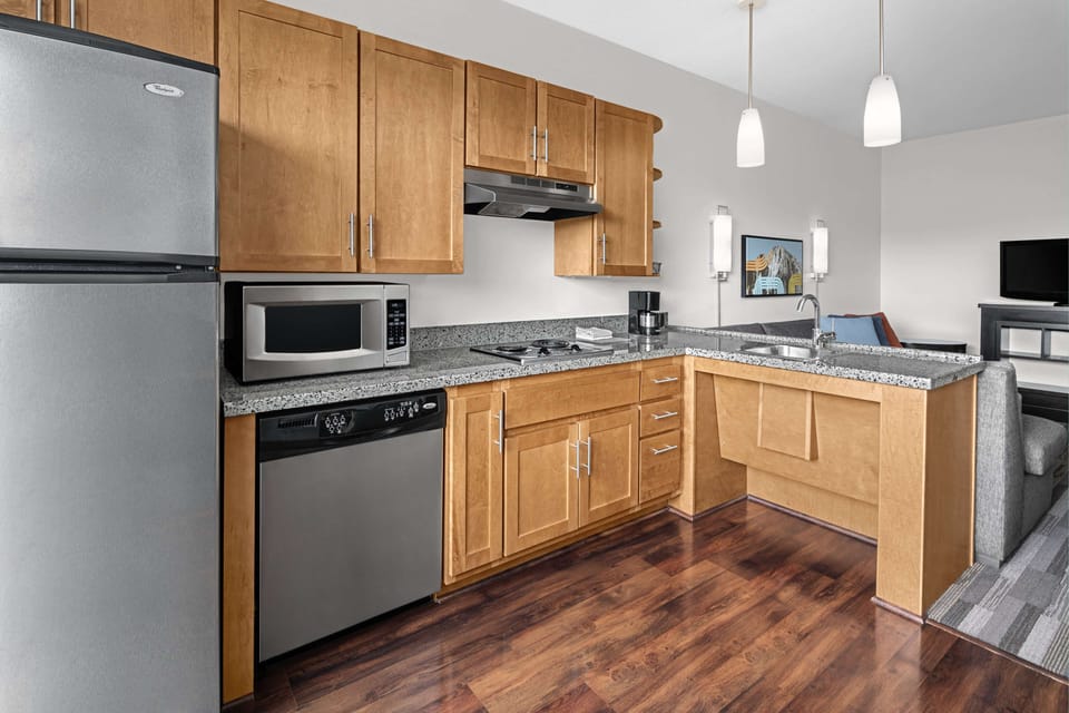 Studio Suite, 1 King Bed with Sofa bed | Private kitchen | Full-size fridge, microwave, dishwasher, coffee/tea maker
