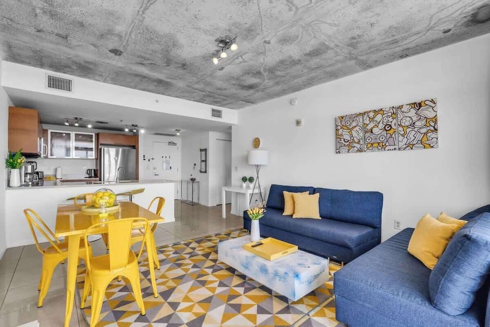 "Stay in this chic Airbnb apartment with vibrant décor, modern kitchen, and cozy living space."

