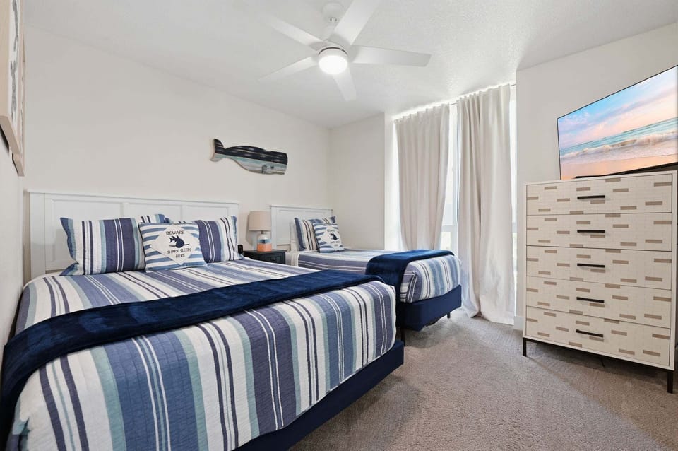 The second bedroom features a TV, ideal for cozy evenings and entertainmen