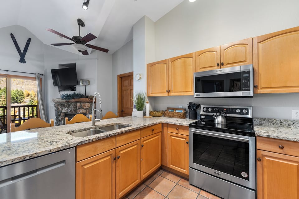 Your spacious kitchen features granite countertops, stainless steel appliances, and everything you need to create delicious meals during your stay.