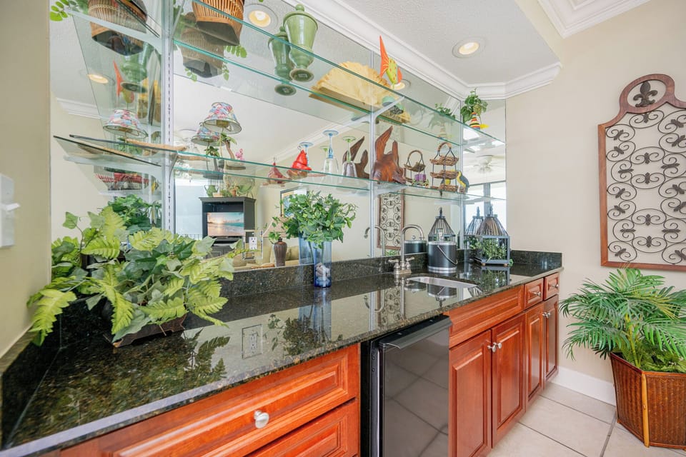 Enjoy mixing your favorite drinks at the stylish wet bar, perfect for toasting to memorable moments