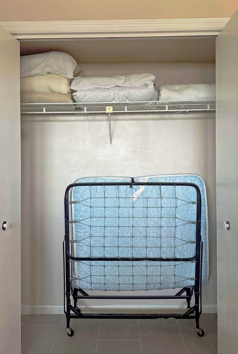 Extra rollaway bed located in Bedroom 2 closet.