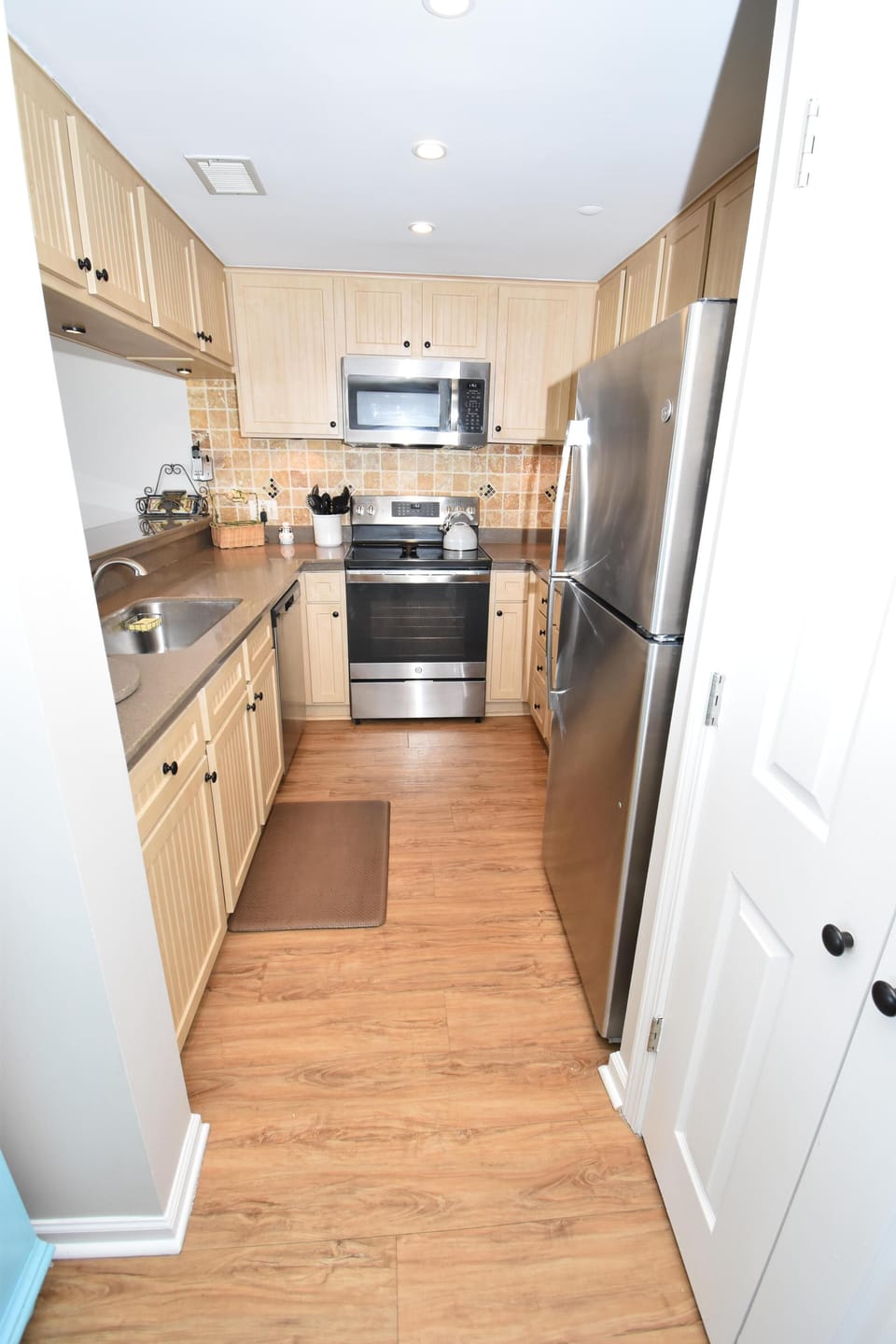 Fully equipped kitchen with stainless appliances.