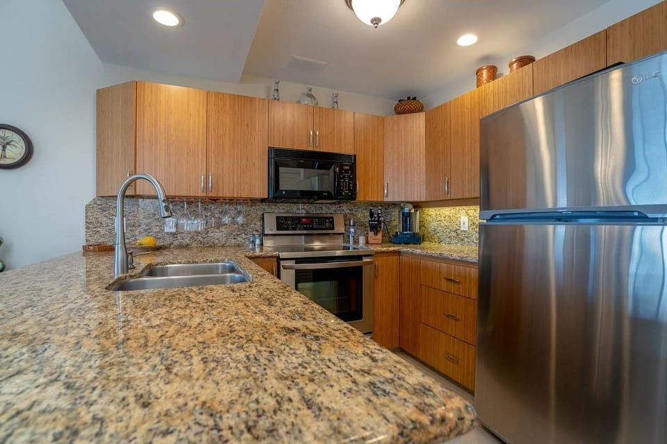 Remodeled kitchen with bamboo cabinets and granite counter tops