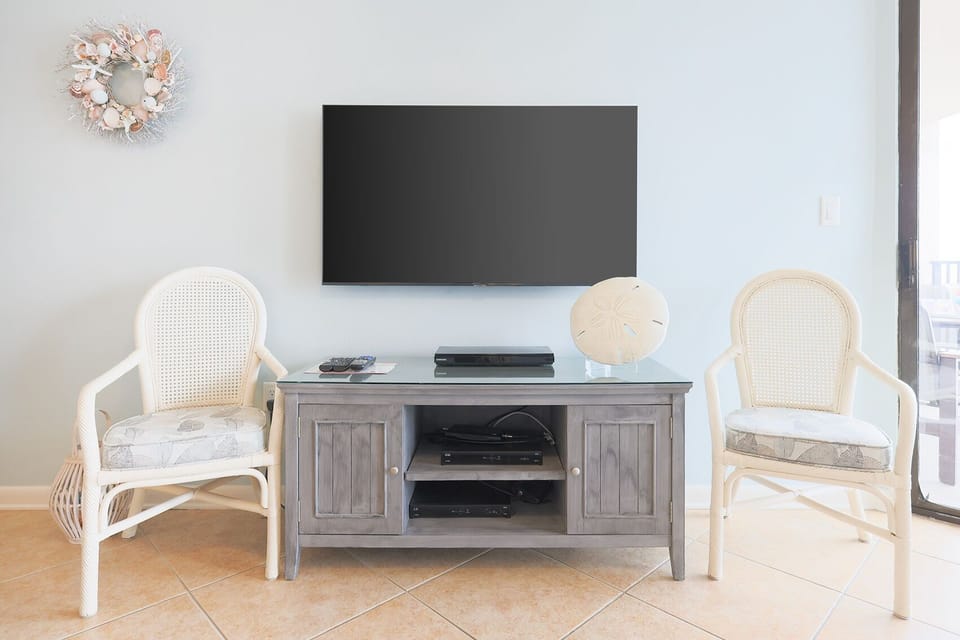 Unwind in the living space, featuring a large TV and charming decor, perfect for relaxation after a day of fun