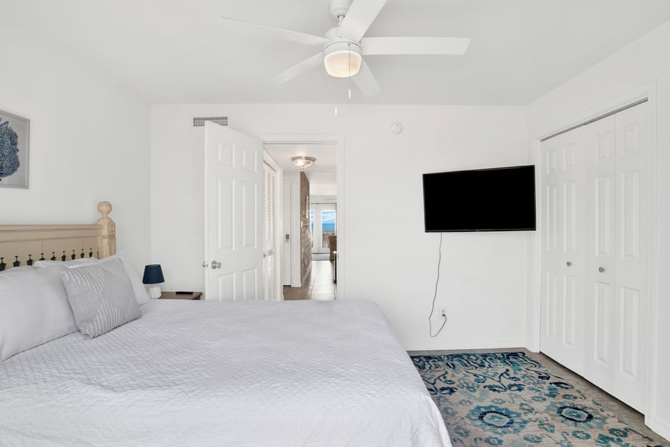 It features a Queen bed and TV