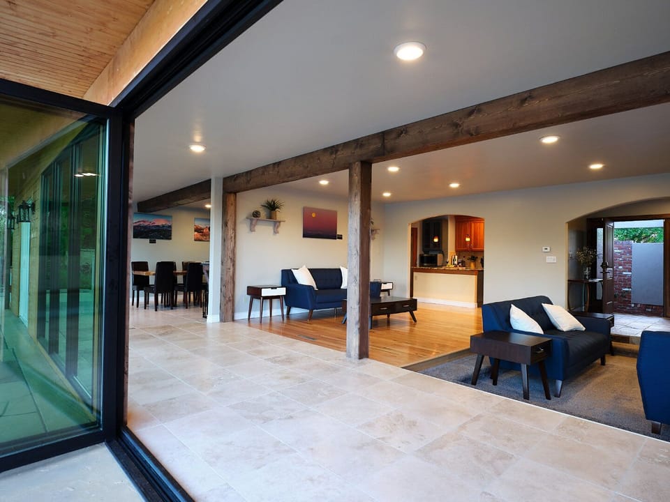 Sliding door leading to deck , ground level , living room kitchen , dining room 