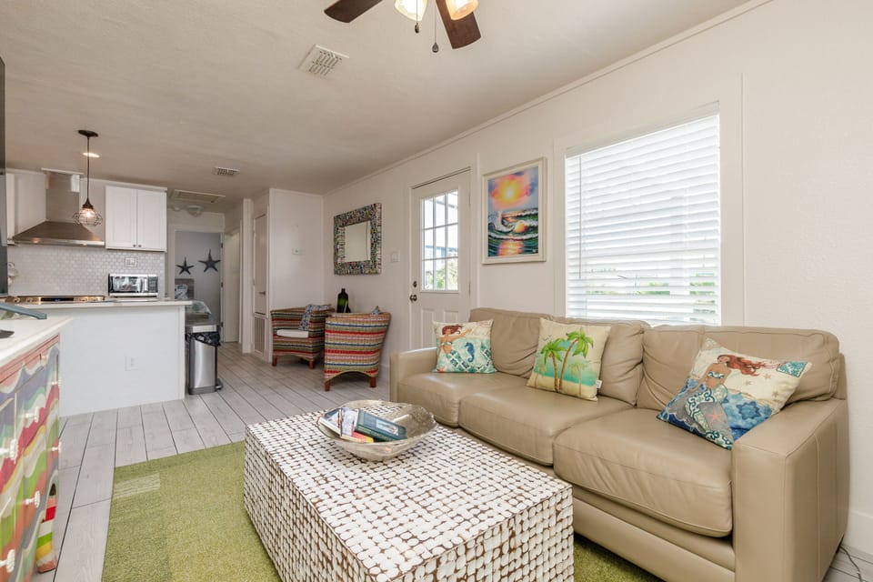 The living room is open to the dining room and kitchen.