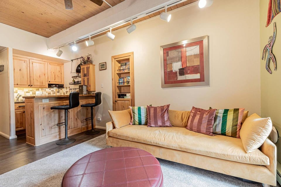 Kick back on the couch and keep an eye on the kitchen — perfect for relaxing and staying in the mix!