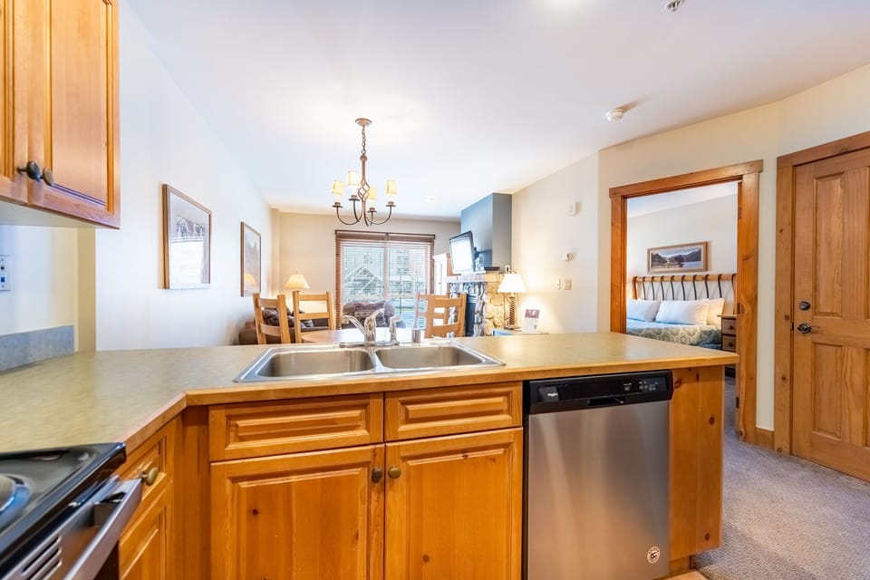 Full size kitchen with stainless steel appliances.