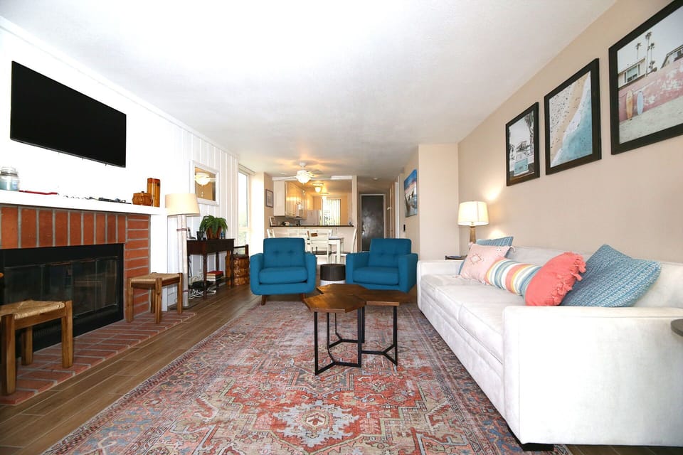 Gas fireplace and flat screen TV in living area