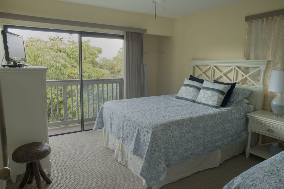 View out bedroom sliders to porch adjoining kitchen