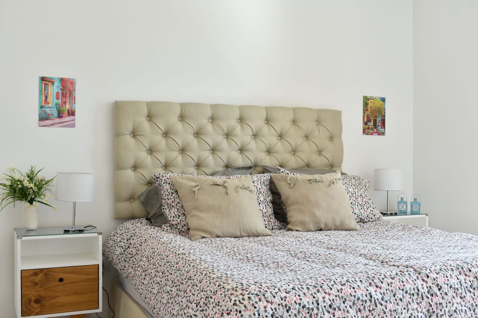 Bright and comfortable, the bedroom has private entrance to the bathroom.