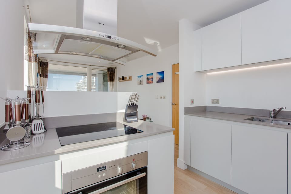 Stylish kitchen island with all utensils, pan sets, knife set and cutleries