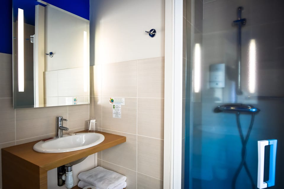 Shower, free toiletries, hair dryer, towels