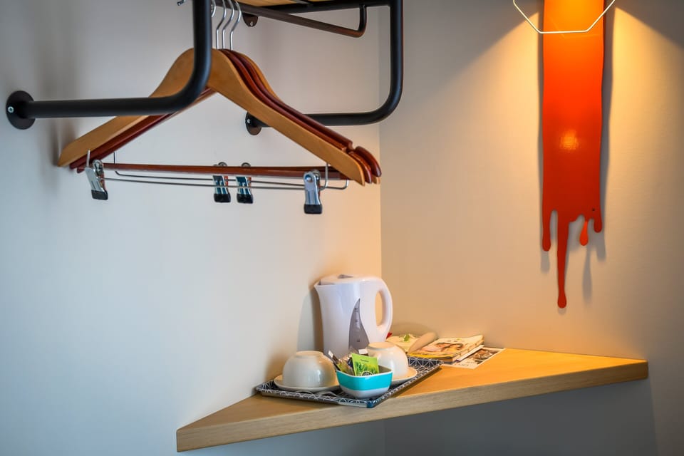 Twin Room | Desk, blackout drapes, iron/ironing board, free WiFi