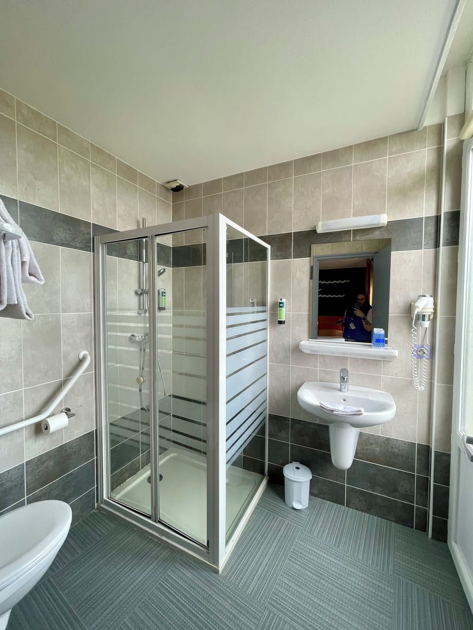 Shower, rainfall showerhead, hair dryer, towels