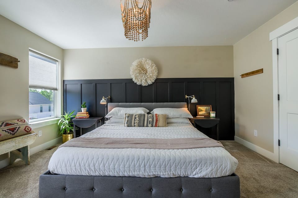 Luxurious king bed in master. All rooms feature installed reading lights