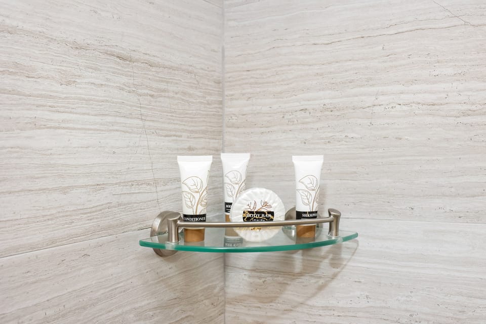 Shower, rainfall showerhead, free toiletries, hair dryer