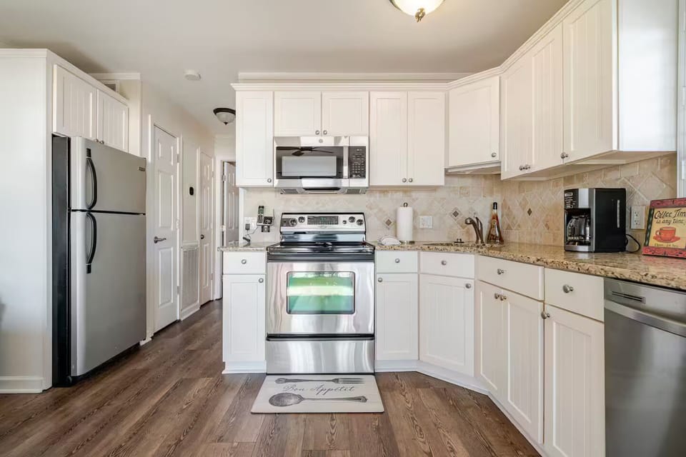 Kitchen with stainless steel appliances,  granite counter tops with extra space.