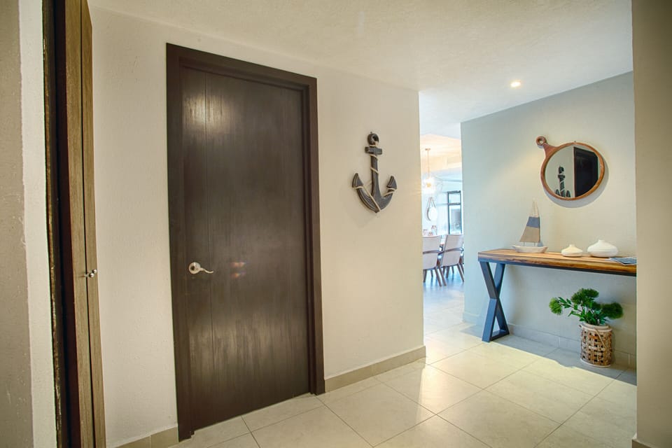 Main entrance to the condo and door to half bathroom