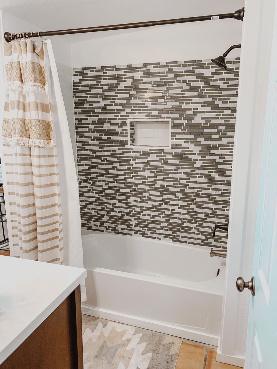 Bathroom with combo bath shower combo.