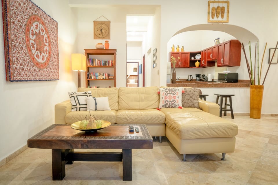 Family Apartment, Multiple Beds | Living room | Flat-screen TV