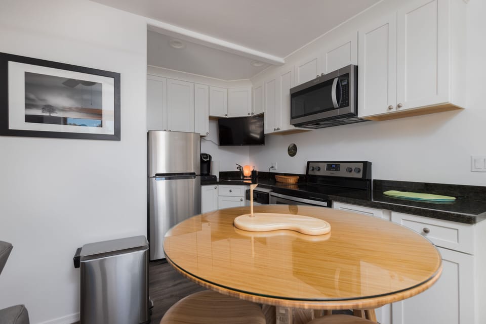 Modern kitchen with refrigerator, microwave, oven, stove, dishwasher